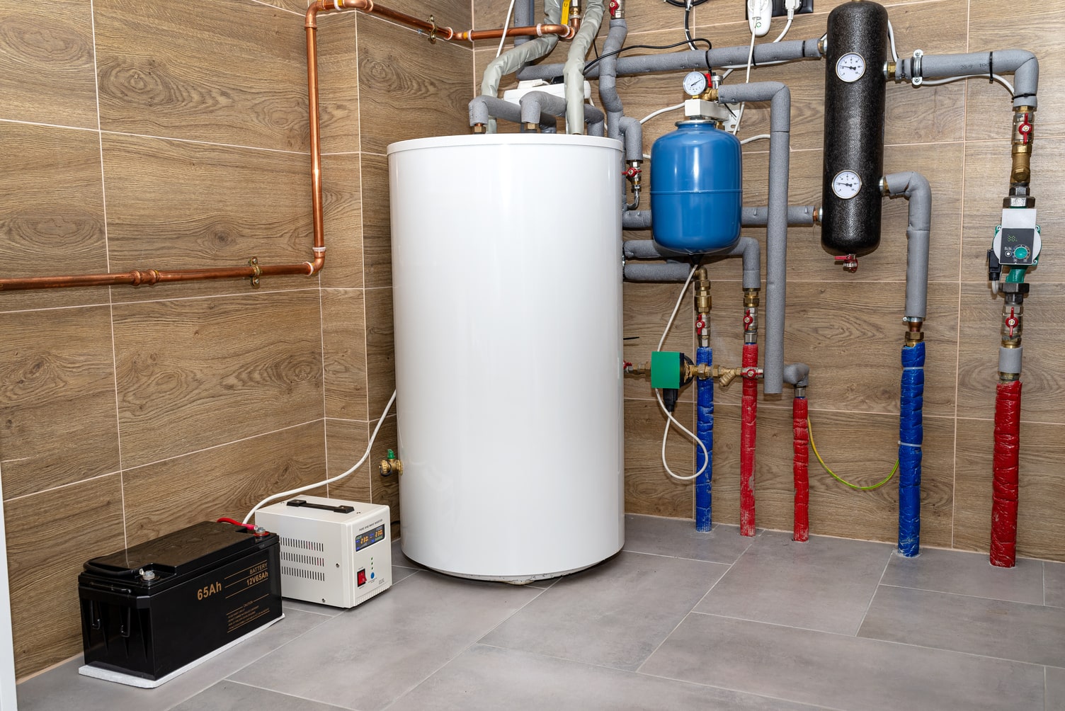 Modern home water heating system with boiler and piping.